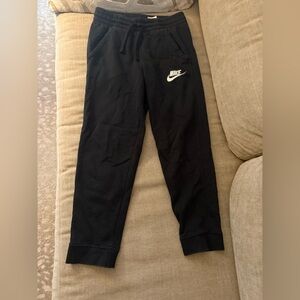 Black Nike sweatpants. Size medium (10/12). Side pockets